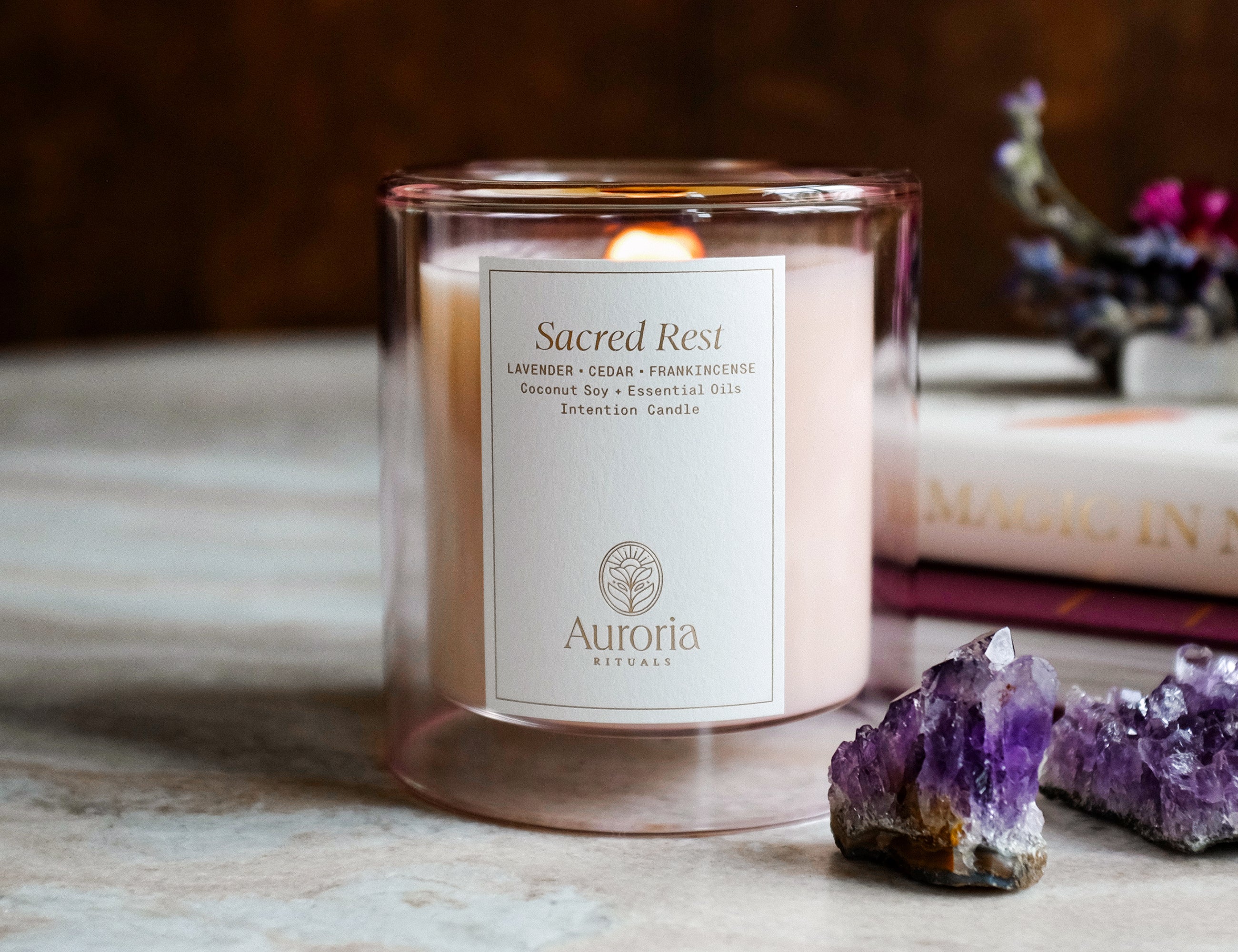 Auroria Rituals Sacred Rest Intention Candle made with pure essential oils. Coconut soy wax essential oil candle with amethyst crystal inside